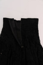 Black floral lace A-line skirt by Dolce & Gabbana with cutout details, flowing design, and intricate lace pattern.