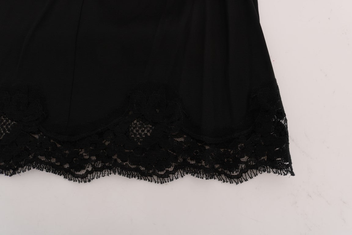 Black floral lace A-line skirt by Dolce & Gabbana with cutout detailing and a fitted waist, shown on a model.