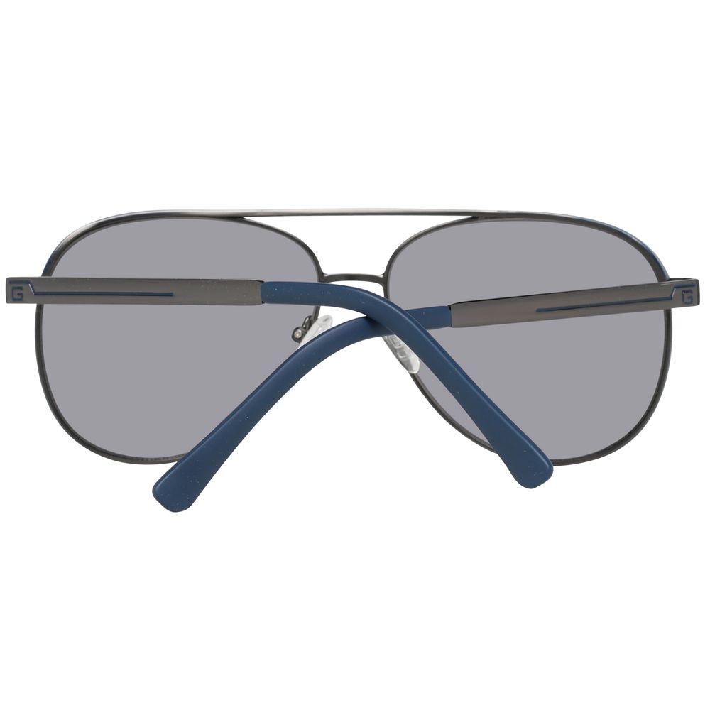 Guess gray metal sunglasses with round lenses and slim metal frames, stylish and modern accessory for sun protection