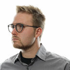 Police gray metal and plastic glasses frames with clear lenses, showcasing a sleek, modern design for stylish eyewear.