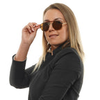 Tommy Hilfiger gold metal and plastic sunglasses with stylish frames and tinted lenses.