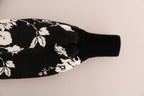 Dolce & Gabbana black fur floral brocade zipper sweater displayed on a hanger with intricate floral patterns and luxurious fabric.