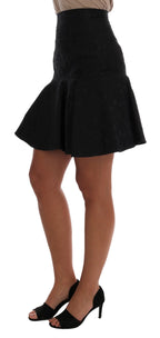 Black floral jacquard silk A-line skirt by Dolce & Gabbana, featuring intricate floral patterns and a flowing silhouette.