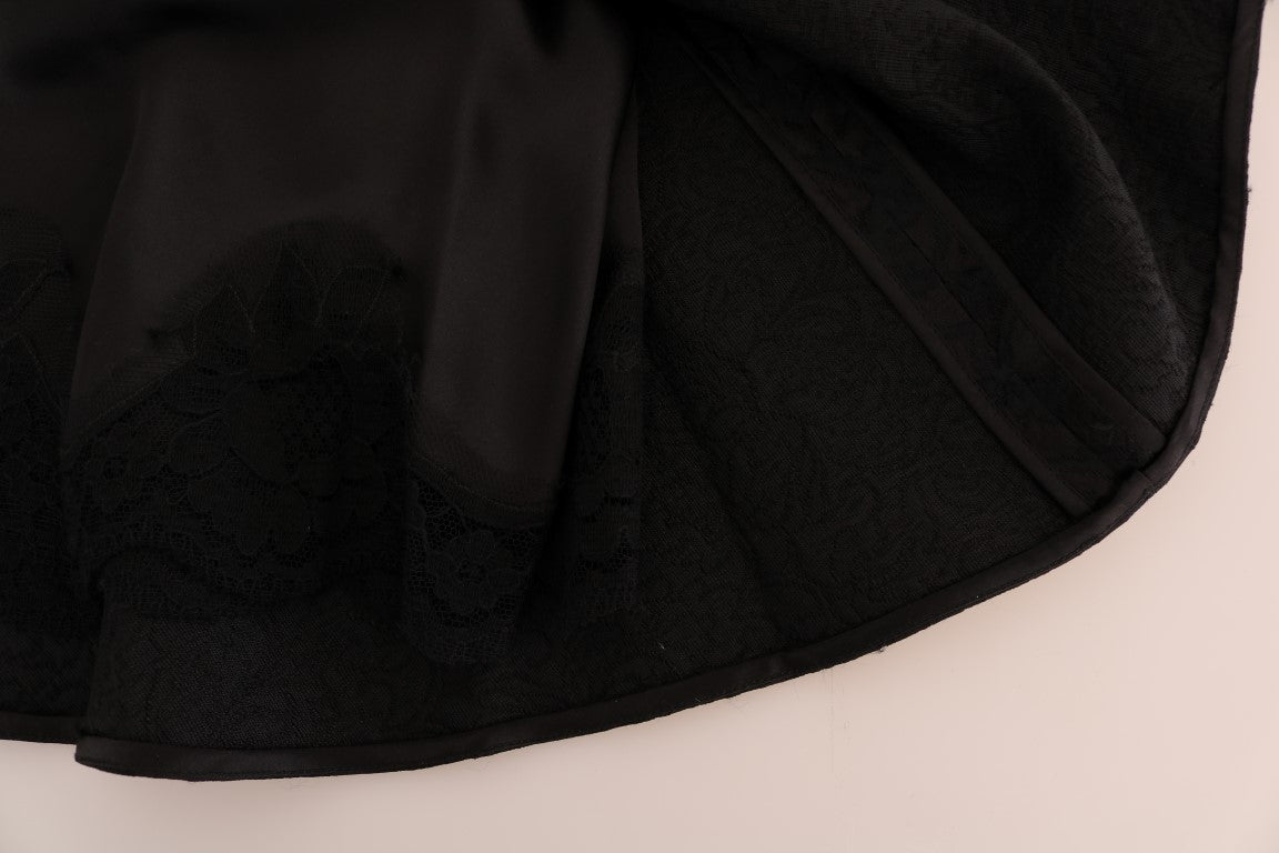Dolce & Gabbana black floral jacquard silk A-line skirt with intricate floral pattern and elegant design.