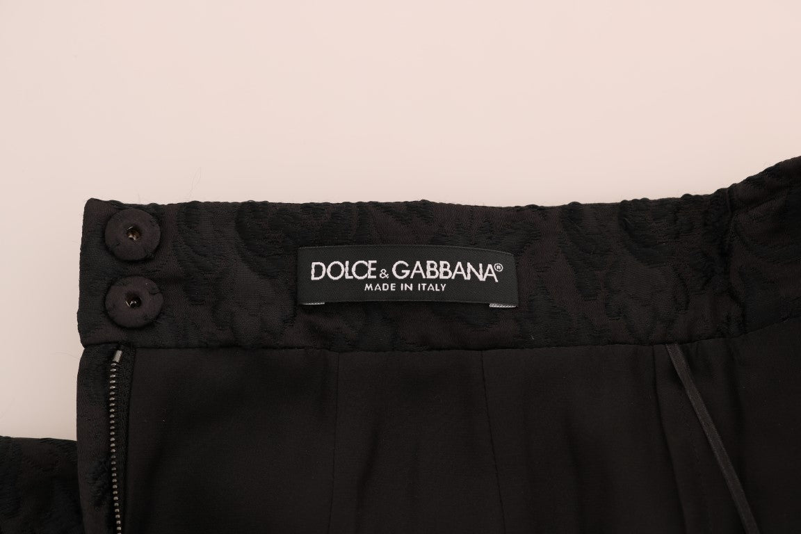 Dolce & Gabbana black floral jacquard silk A-line skirt with intricate floral pattern and elegant design.