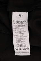Dolce & Gabbana black floral jacquard silk A-line skirt with a fitted waist and intricate floral pattern.
