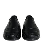 Dolce & Gabbana black foiled rubber low-top men's sneakers with sleek design and branding, ideal for casual wear.