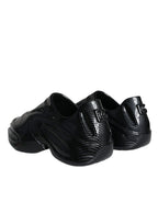 Dolce & Gabbana black foiled rubber low-top men's sneakers with sleek design and logo accents.