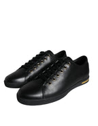 Dolce & Gabbana black leather classic sneakers with gold accents, stylish men's footwear, front view showing design details.