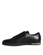 Dolce & Gabbana black leather and gold accents classic sneakers shoes, showing stylish design and textured sole.
