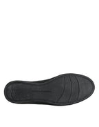 Dolce & Gabbana black leather and gold accents classic sneakers with stylish design and white rubber soles.
