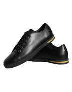 Dolce & Gabbana black leather classic sneakers with gold accents, stylish casual shoes for men.