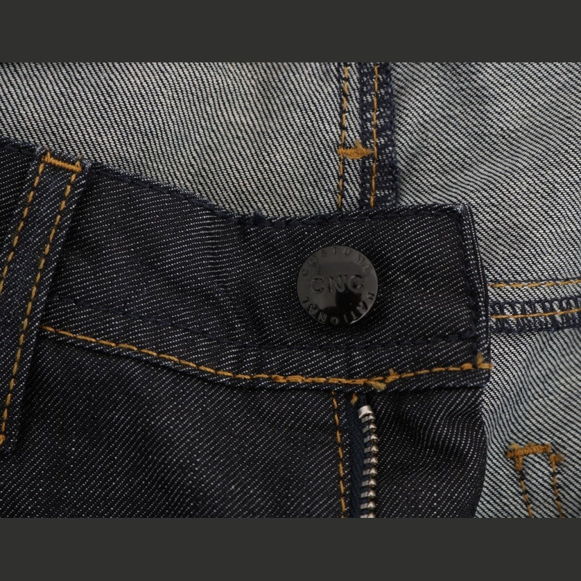 Dark blue cotton classic fit jeans by Costume National, showing a close-up of the denim fabric and stitching details.