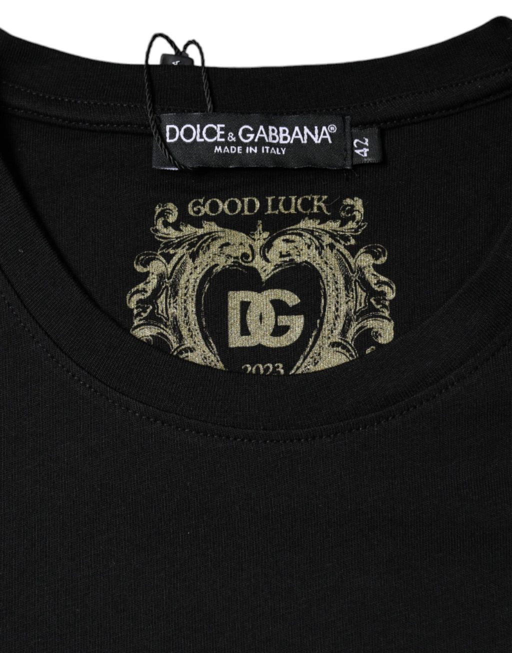 Black cotton Dolce & Gabbana crew neck short sleeve T-shirt displayed on a hanger with a simple background.