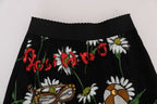 Dolce & Gabbana black embellished daisy brocade skirt with intricate floral detailing and luxurious fabric.