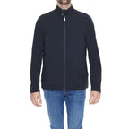 Suns Black Nylon Shell Jacket hanging on a hanger, showcasing its sleek design and smooth fabric for outdoor wear.