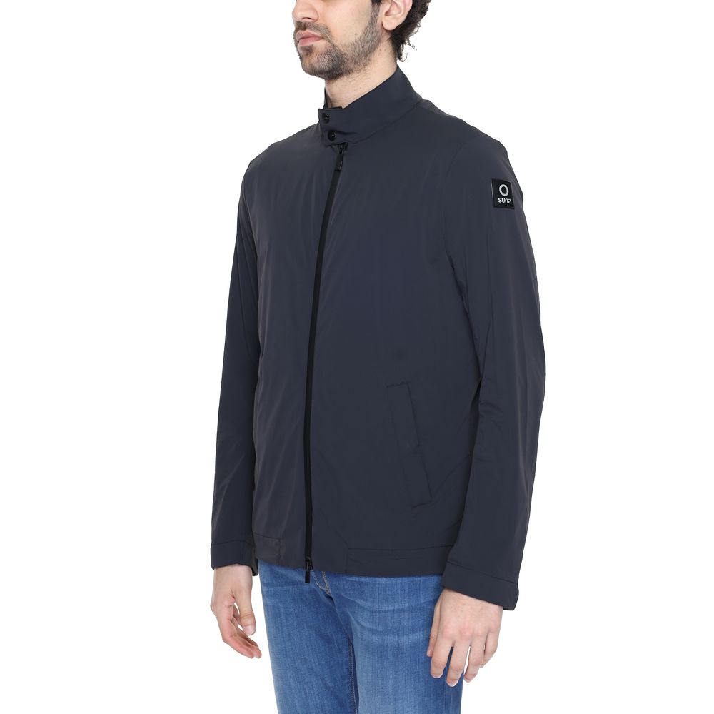 Suns black nylon shell jacket with a sleek design, featuring a full front zipper and adjustable cuffs for a stylish outdoor look.