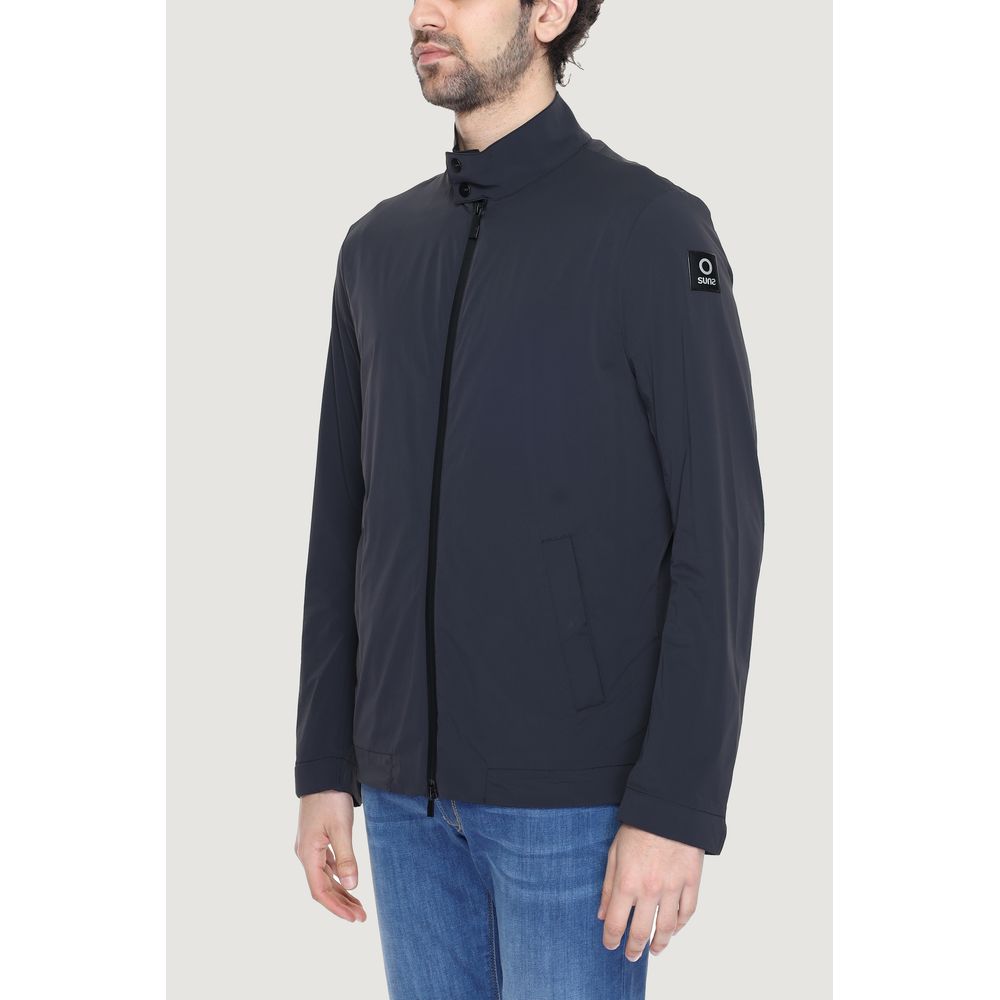 Suns black nylon shell jacket with a hood, front zipper, and adjustable cuffs, designed for outdoor weather protection.