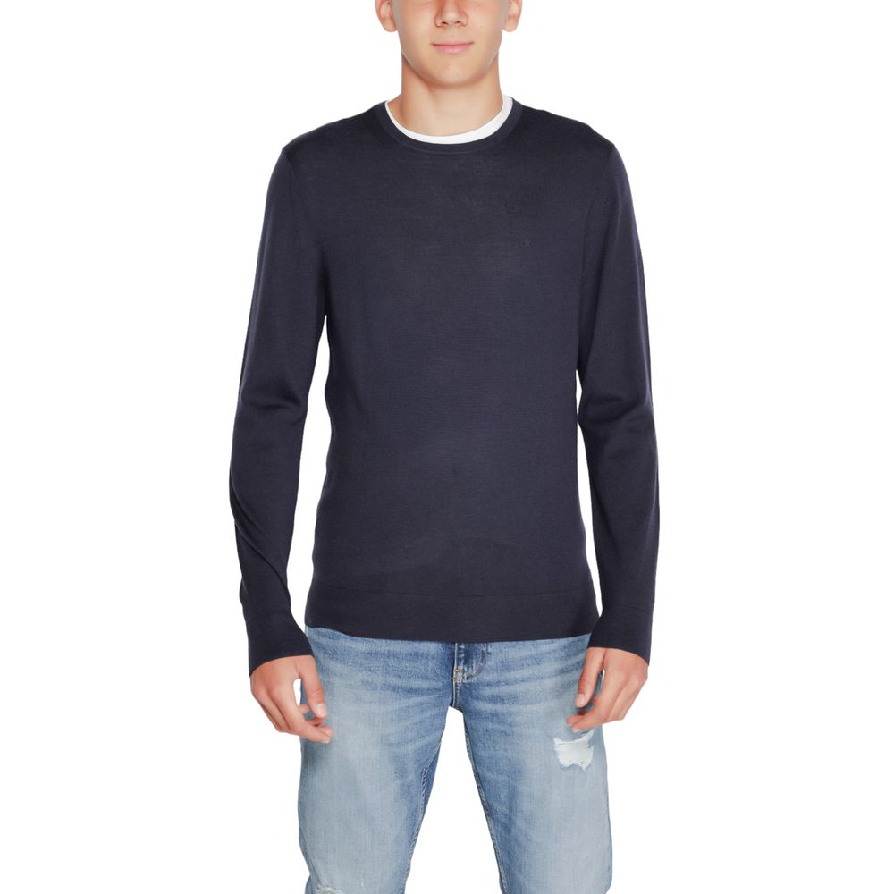 Calvin Klein blue recycled wool sweatshirt with a crew neckline and long sleeves, laid flat on a white background.