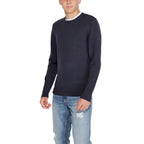 Calvin Klein blue recycled wool sweatshirt featuring a crew neck and long sleeves, displayed on a neutral background.