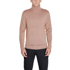 Calvin Klein beige wool turtleneck sweater displayed on a mannequin, showcasing its soft fabric and classic fit.
