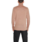 Beige Calvin Klein wool turtleneck sweater, close-up of fabric and collar, showcasing soft knit texture and classic style.