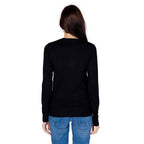 Black cotton sweatshirt by Guess with a crew neck and long sleeves, featuring the Guess logo on the front.