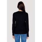 Black cotton sweatshirt by Guess, featuring a relaxed fit and classic crewneck design, with subtle brand logo detail.