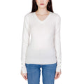 White cotton sweatshirt by Guess featuring a classic crewneck and long sleeves, displayed on a neutral background.