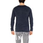 Blue cotton sweatshirt by Jack Jones laid flat, showcasing the casual crew neck design and soft fabric texture.