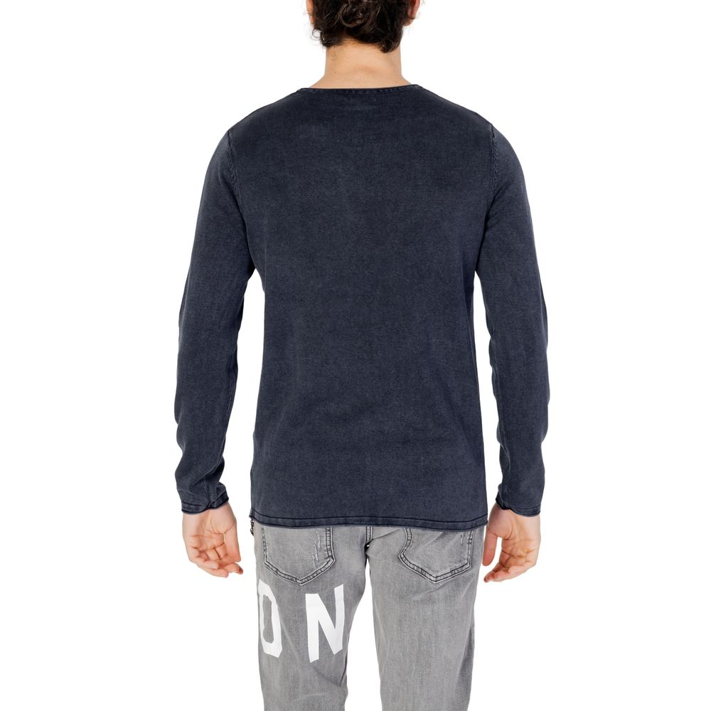Blue cotton sweatshirt by Jack Jones laid flat, showcasing the casual crew neck design and soft fabric texture.