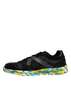 Black polyester low top men's sneakers by Dolce & Gabbana, featuring sleek design and sporty style.