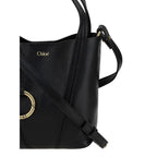 Chloé Bos Taurus shoulder bag made of black calf leather with silver hardware and structured design.