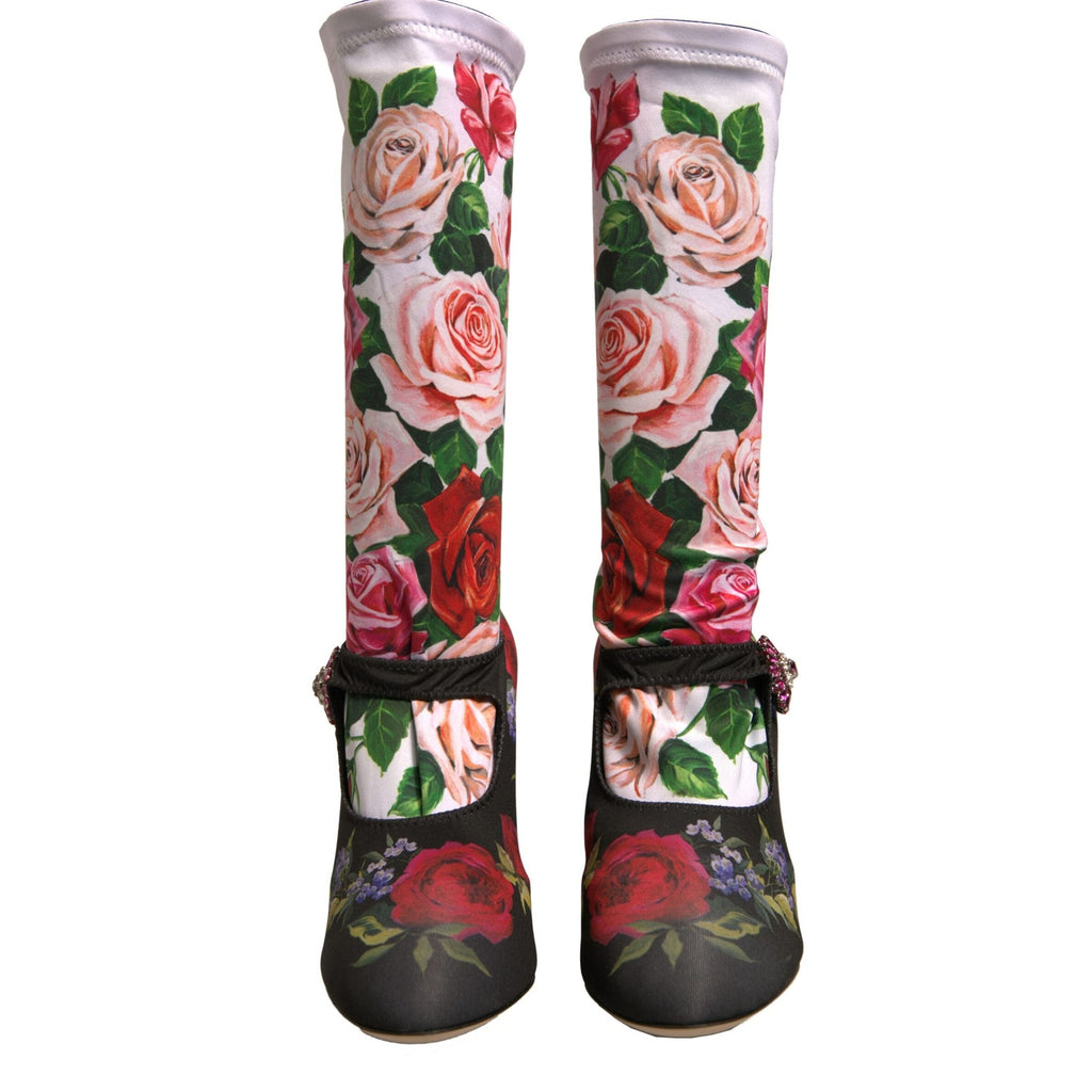 Dolce & Gabbana black floral socks paired with crystal-embellished jersey shoes, featuring stylish and intricate design details.