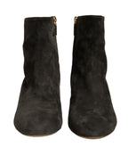 Dolce & Gabbana black embellished heel ankle boots with pointed toe and stylish design.