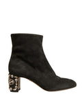 Black embellished heel ankle boots by Dolce & Gabbana with pointed toes and decorative detailing.