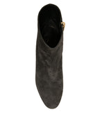 Dolce & Gabbana black embellished heel ankle boots with pointed toe and decorative details on the leather shoes.