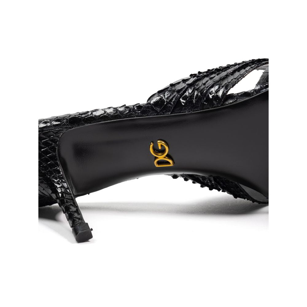 Dolce & Gabbana black snake skin platform sandals with ankle straps and chunky heels.