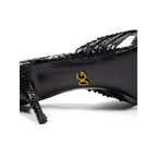 Dolce & Gabbana black snake skin platform sandals with ankle straps and chunky heels.