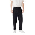 Calvin Klein Jeans black polyester casual pants with a relaxed fit, featuring a modern design and classic waistband.