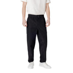 Calvin Klein Jeans black polyester casual pants with a relaxed fit, featuring a modern design and classic waistband.