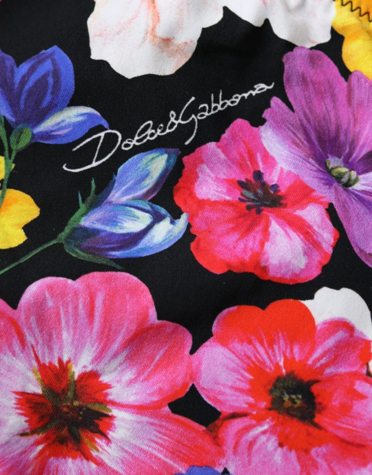 Dolce & Gabbana black floral print bikini bottom with stylish swimwear design and fitted cut.