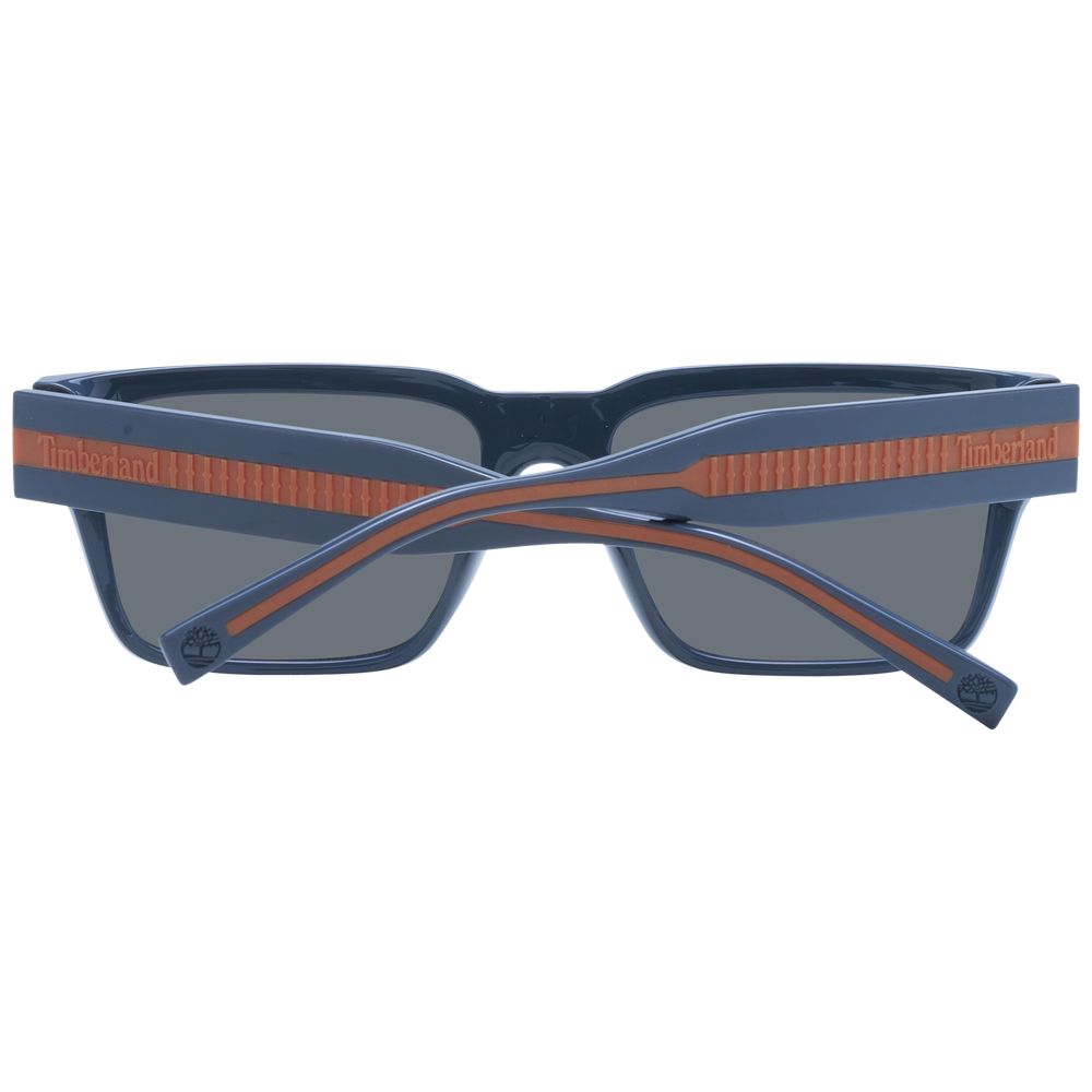 Timberland gray plastic sunglasses with rounded frames and dark tinted lenses, stylish and lightweight for casual wear.