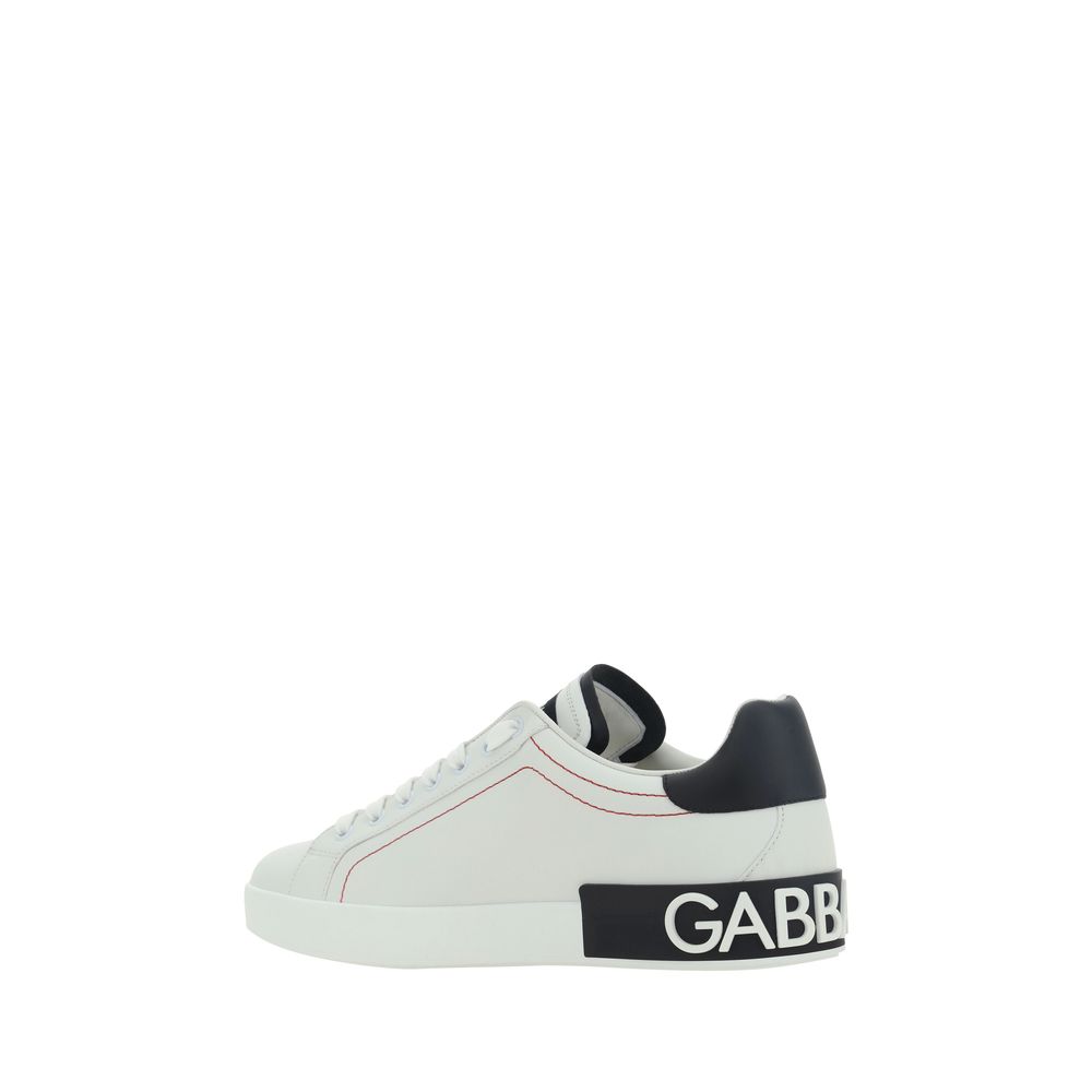 White calf leather Dolce & Gabbana Bos Taurus low top sneakers with logo details and sleek design.