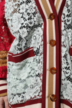 Multicolor floral lace Dolce & Gabbana cardigan sweater with intricate lace details and vibrant floral pattern.