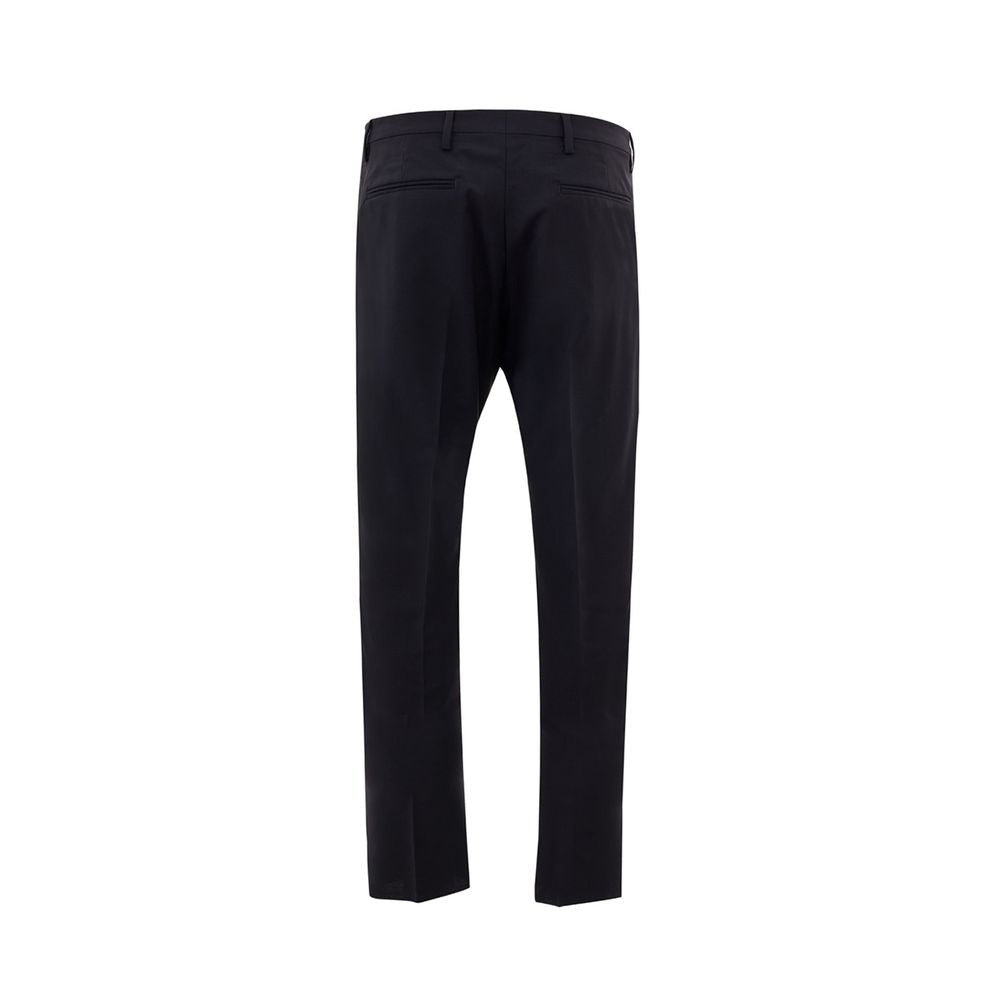 Valentino Garavani black wool dress pants with tailored fit and sleek design, shown on a hanger.