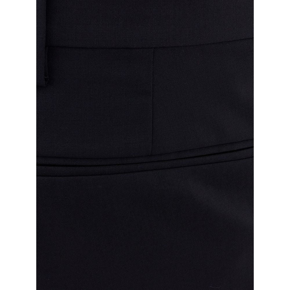 Valentino Garavani black wool dress pants displayed on a hanger, showcasing tailored fit and sleek design.