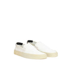 Saint Laurent white cotton low-top sneakers with laces and minimalist design, showcasing clean and stylish footwear.