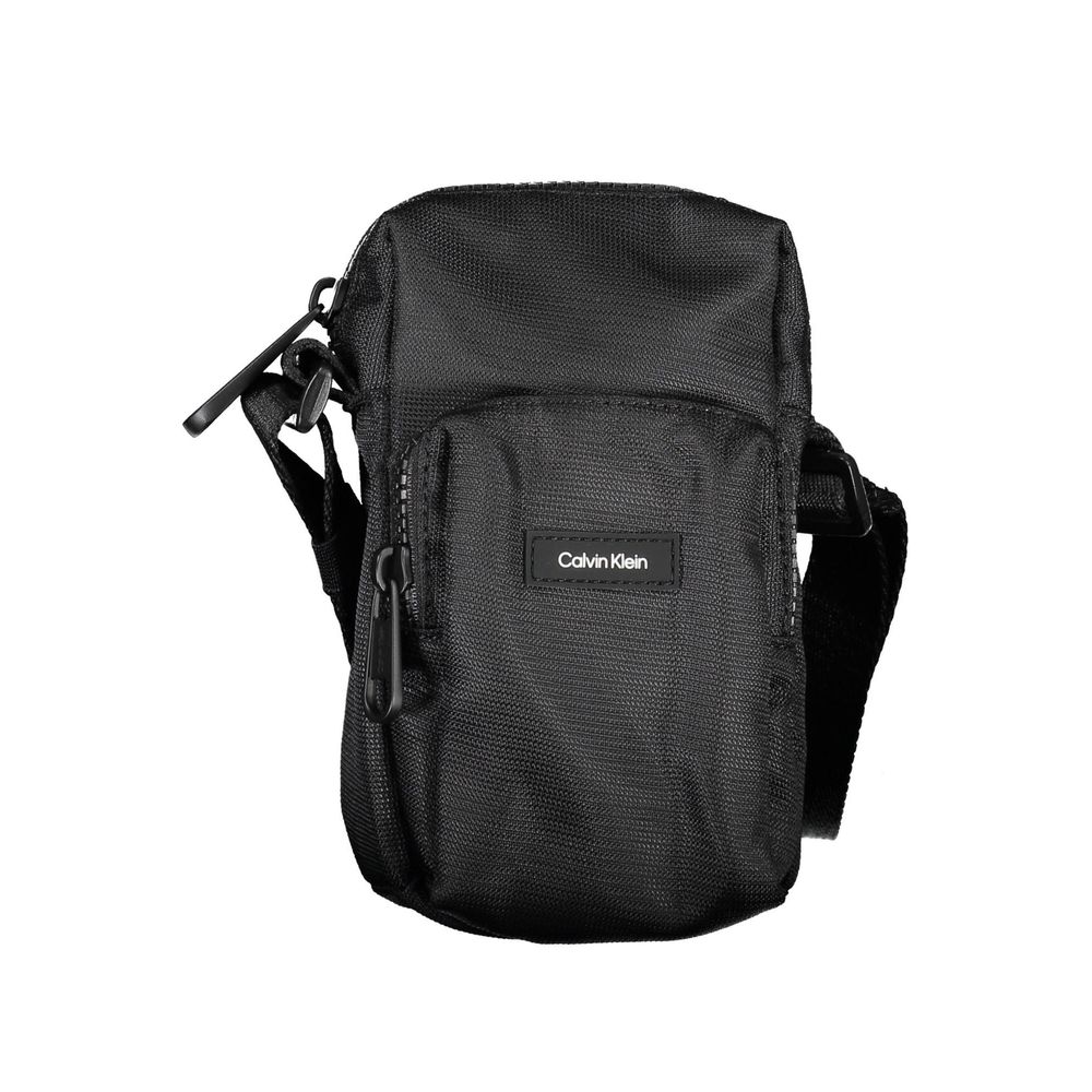 Black Calvin Klein shoulder bag with chic detailing, featuring elegant design and stylish accents for versatile fashion.