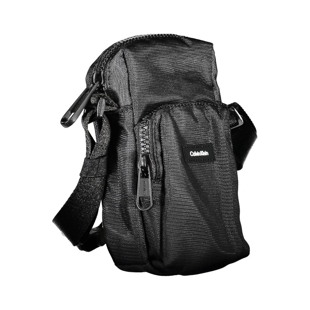 Calvin Klein elegant black shoulder bag with chic detailing, featuring sleek design and stylish accents.
